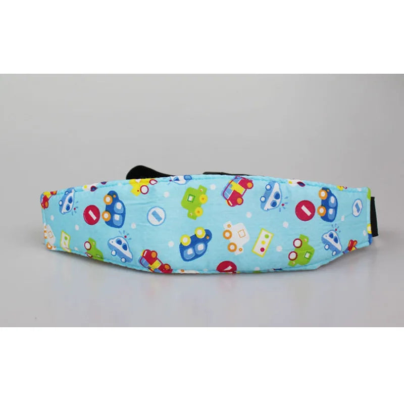 Blue fabric sleeping headrest for a baby car seat featuring colorful toys and a black strap.