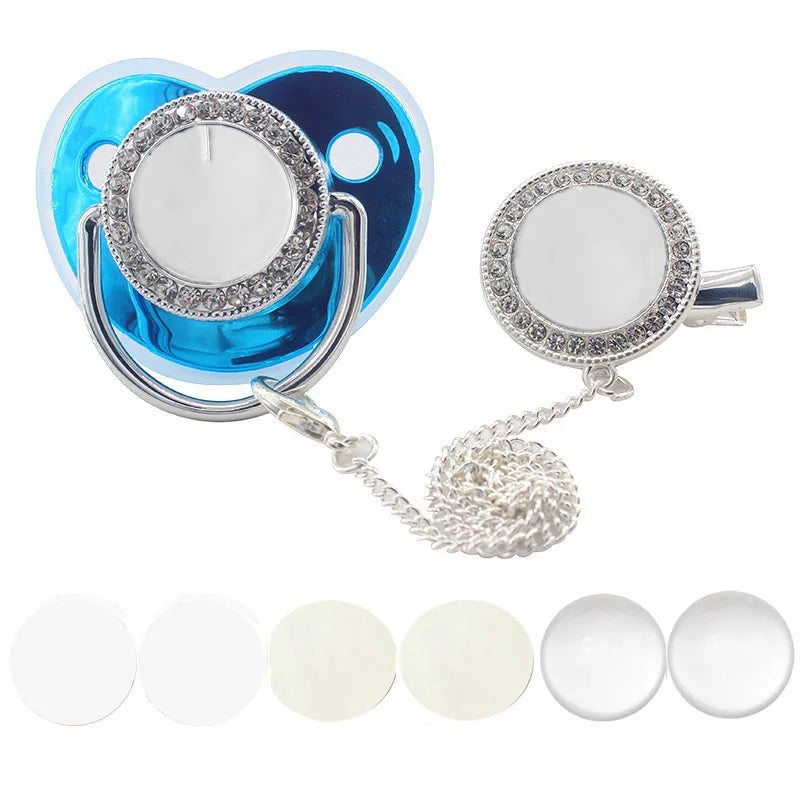A sparkling rhinestone pacifier with a clip and chain for babies, featuring a heart-shaped silicone shield.