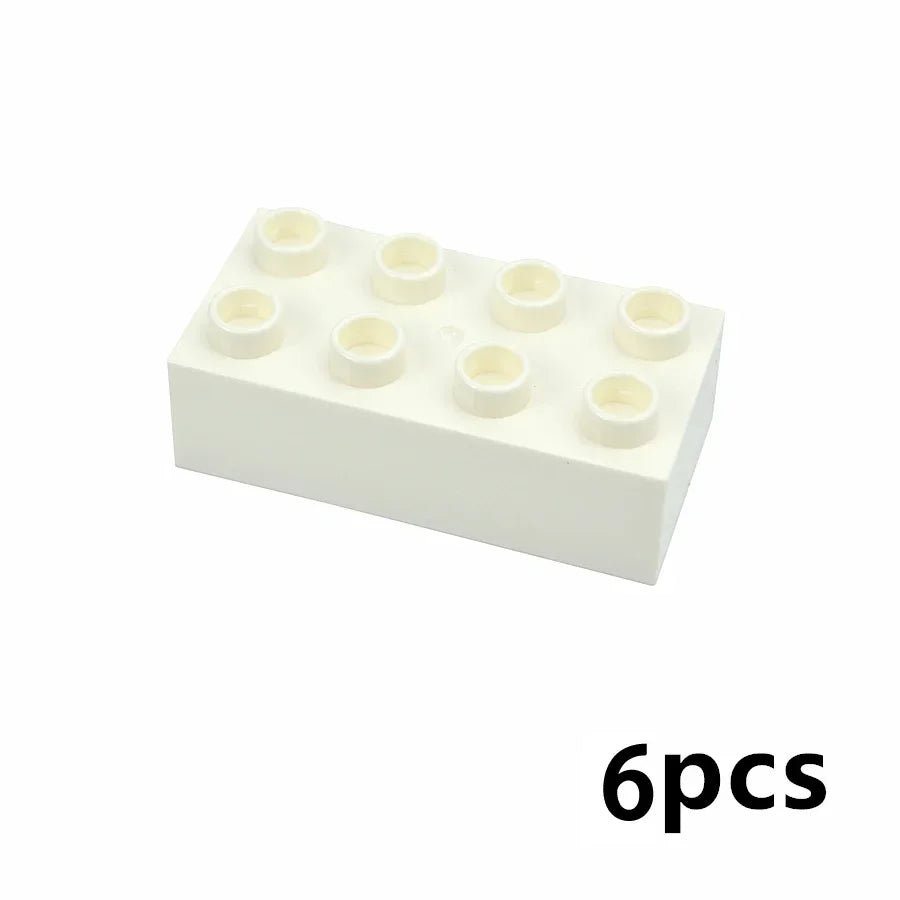 A white tray holding six small, round building blocks.