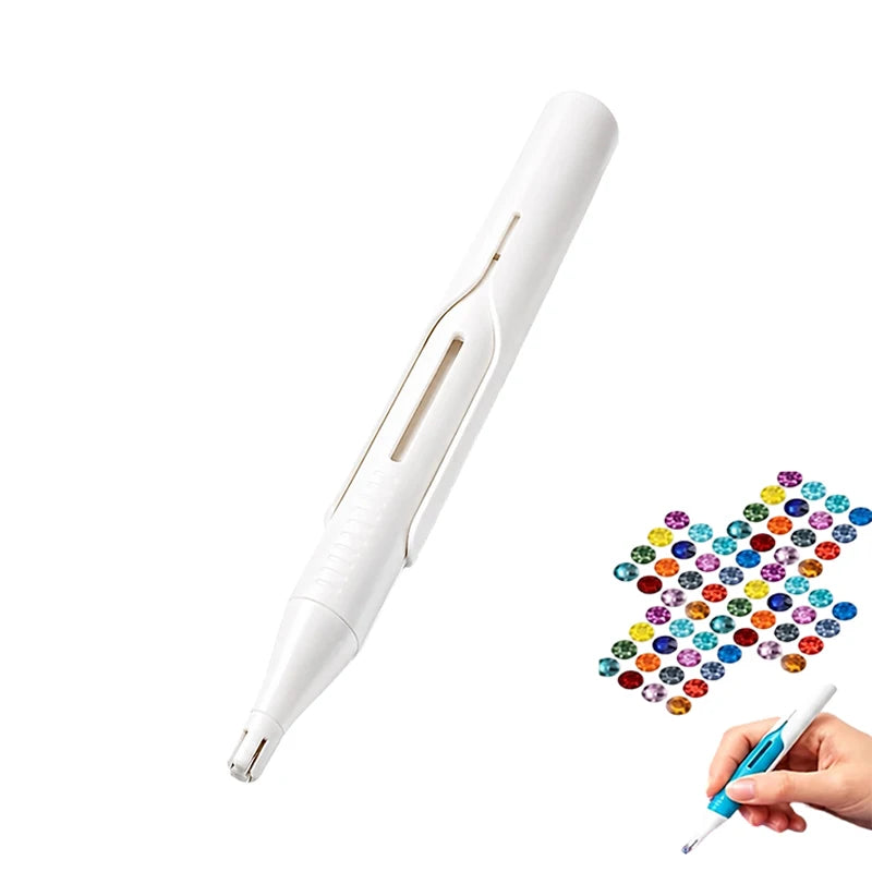 A white automatic diamond painting bead dispenser pen with a precision tip being held by a hand.