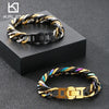 A chunky stainless steel Cuban chain bracelet with alternating gold and black links displayed on a dark surface.