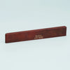 A rectangular piece of reddish-brown wood with the text Guyker ATR-8032 engraved on it.