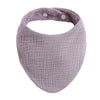 A light purple organic cotton muslin baby bib with an absorbent band around the neck.