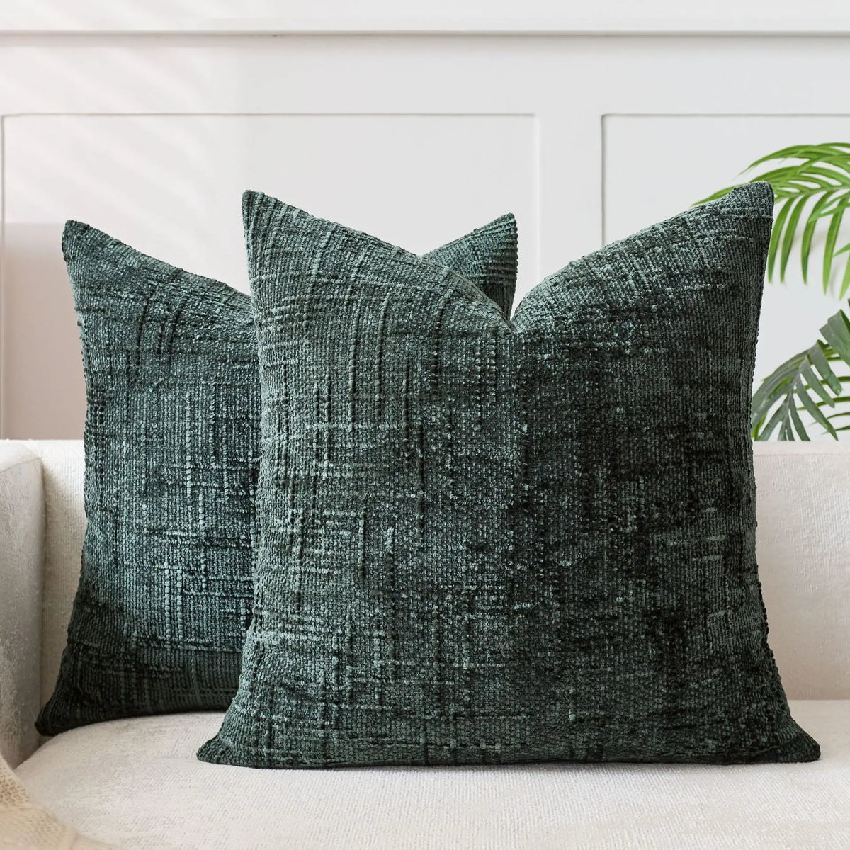 A dark charcoal green handwoven chenille texture cushion cover with a vertical ribbed pattern
