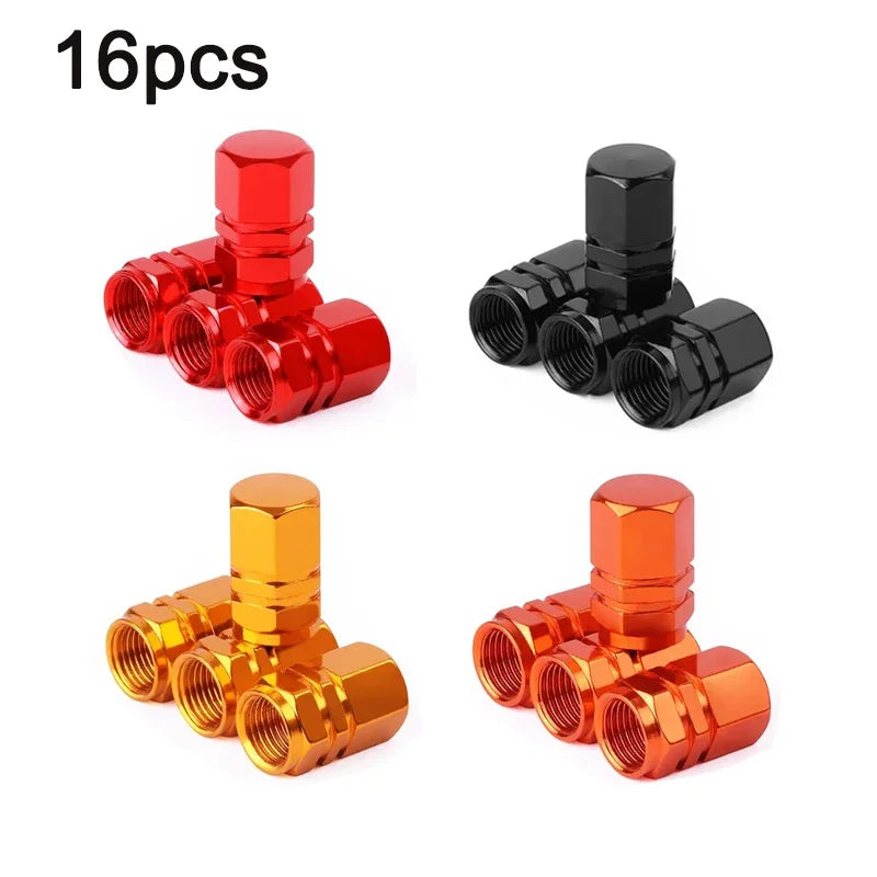 A set of four aluminum alloy wheel tire valve caps in various finishes, including red, black, and gold.