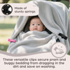 A baby is shown inside a stroller or buggy covered by a soft, light gray blanket secured with versatile clips.