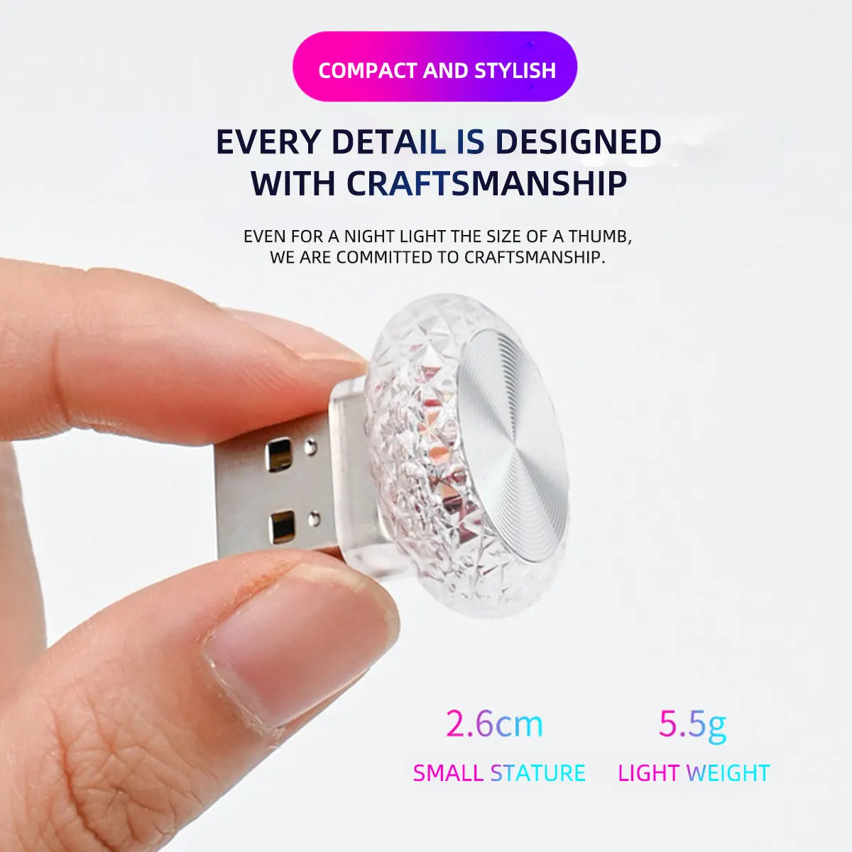 A hand holds a small, clear, ornate LED light fixture designed for car or PC interior use.