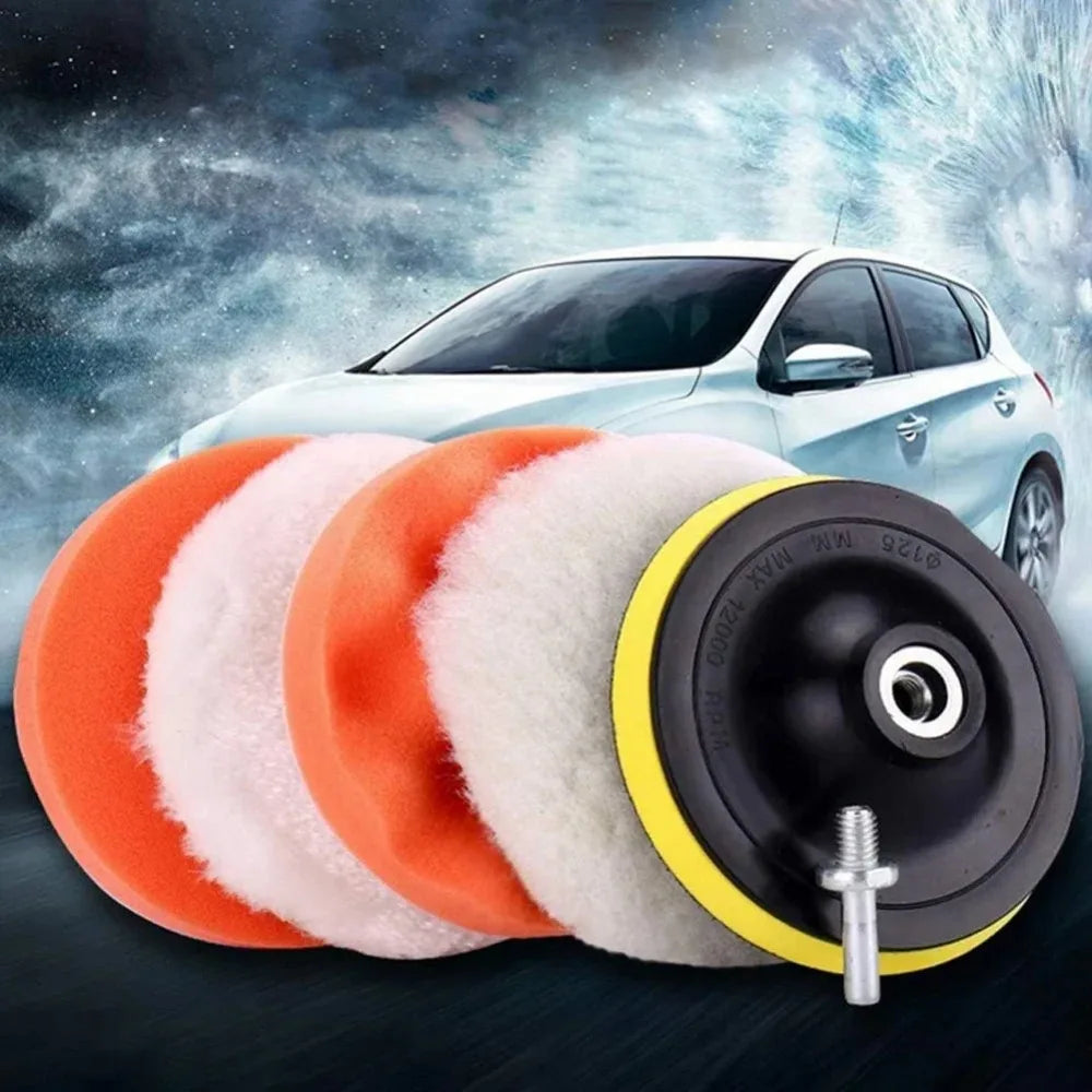 A set of six orange and white polishing pads with a drill adapter shown in front of a light-colored car.