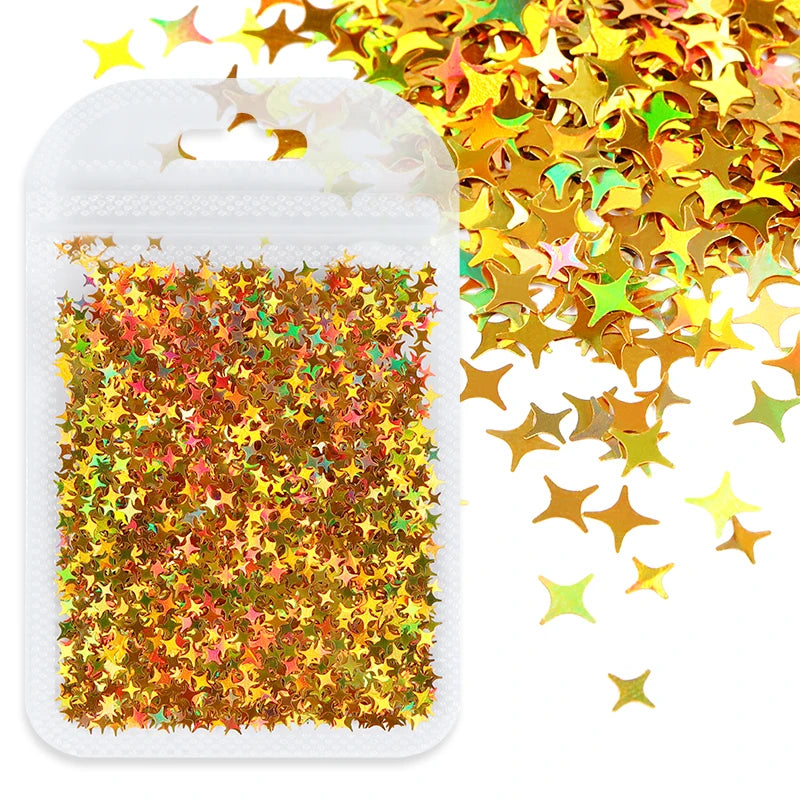 A clear plastic pouch filled with shiny holographic gold and multicolored star sequins for resin crafts.