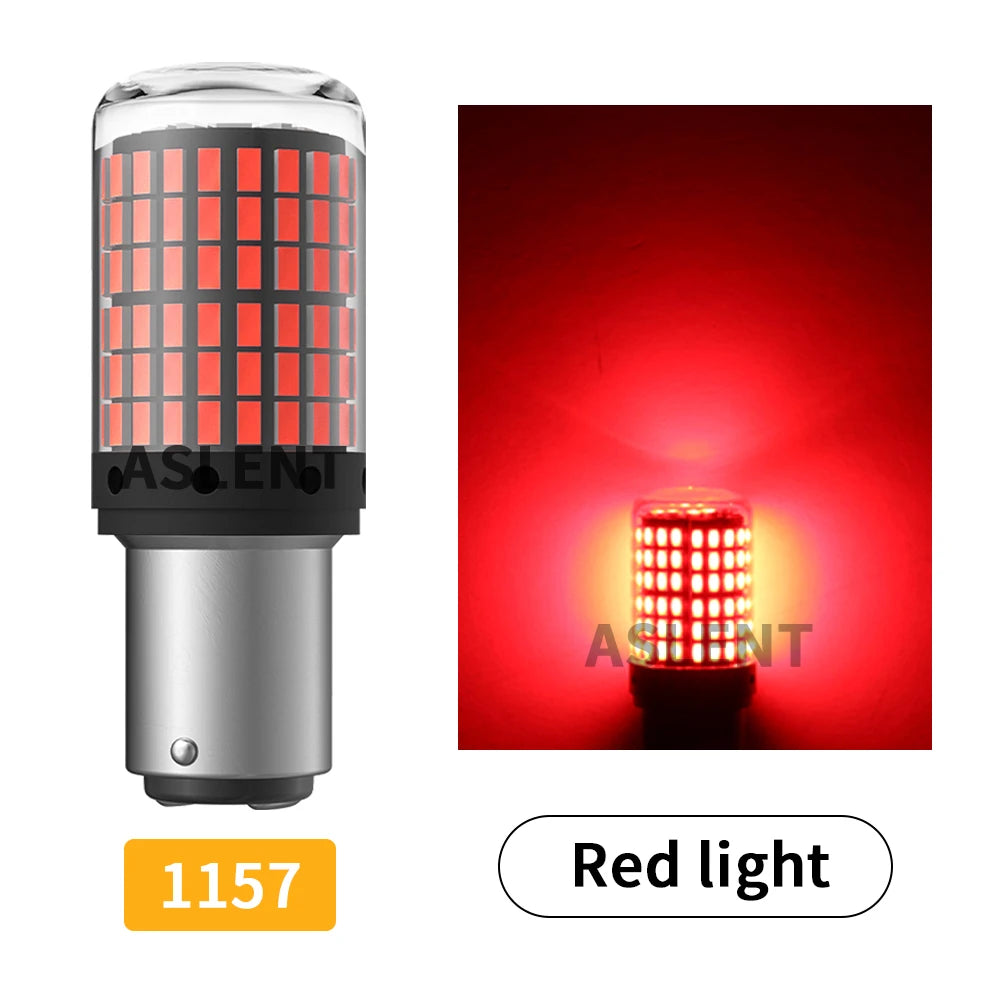 A close-up view of a cylindrical red LED light bulb with a silver base and a grid pattern, emitting bright red light.