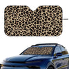Leopard print car windshield sunshade placed on a blue car.