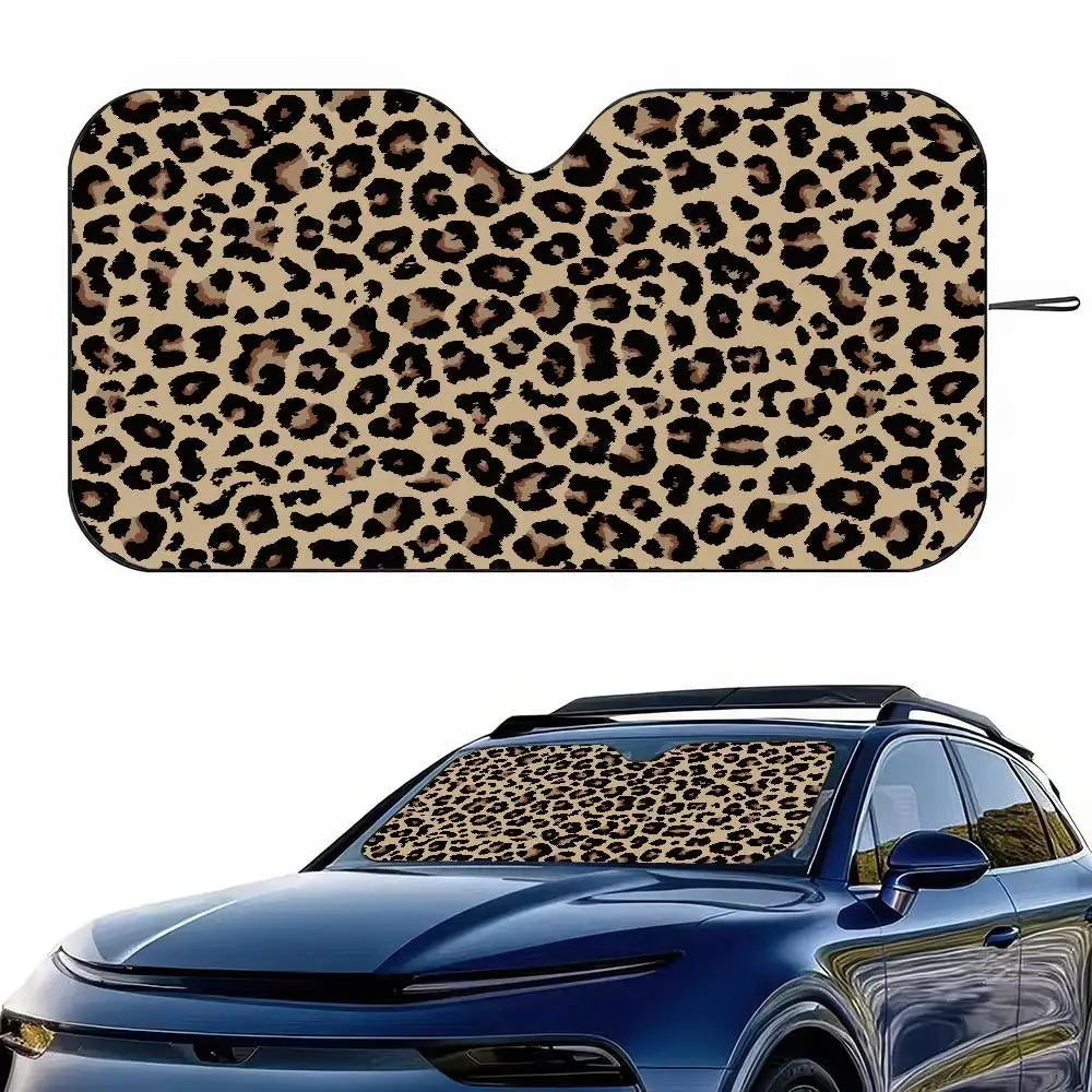 Leopard print car windshield sunshade placed on a blue car.