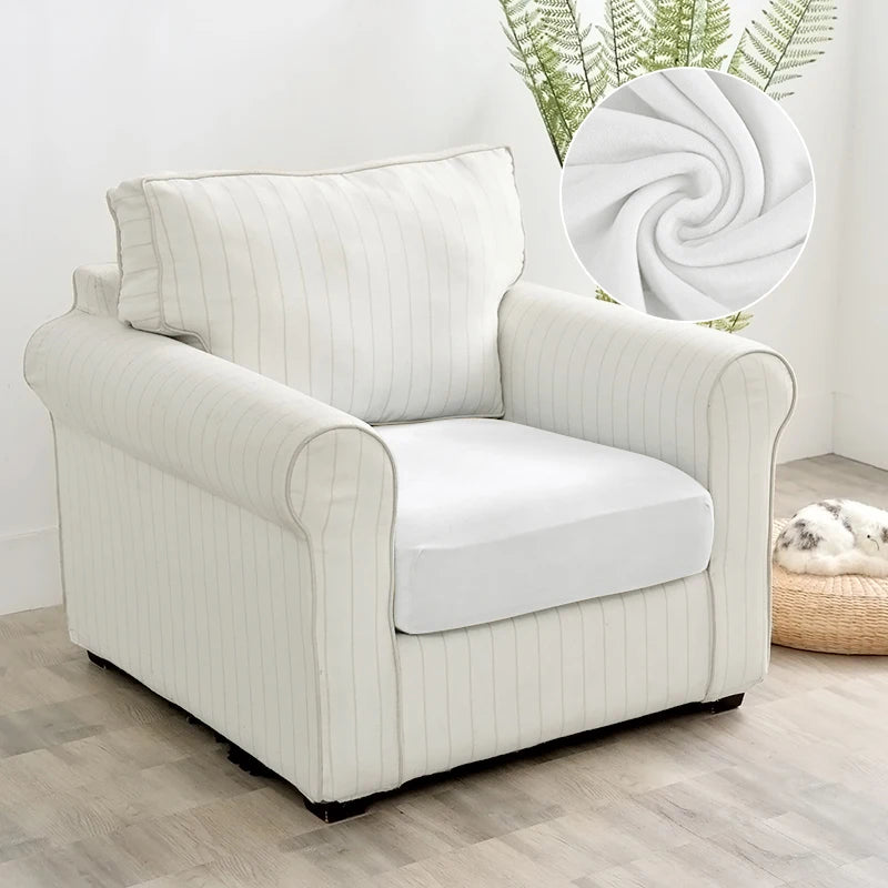 A cream-colored upholstered armchair with vertical stripes and a white seat cushion.