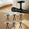 A close-up view of black self-adhesive ceiling curtain rod brackets mounted on a light-colored wall.