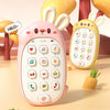 A pink rabbit-shaped baby music phone toy with a teether is shown on a light surface.