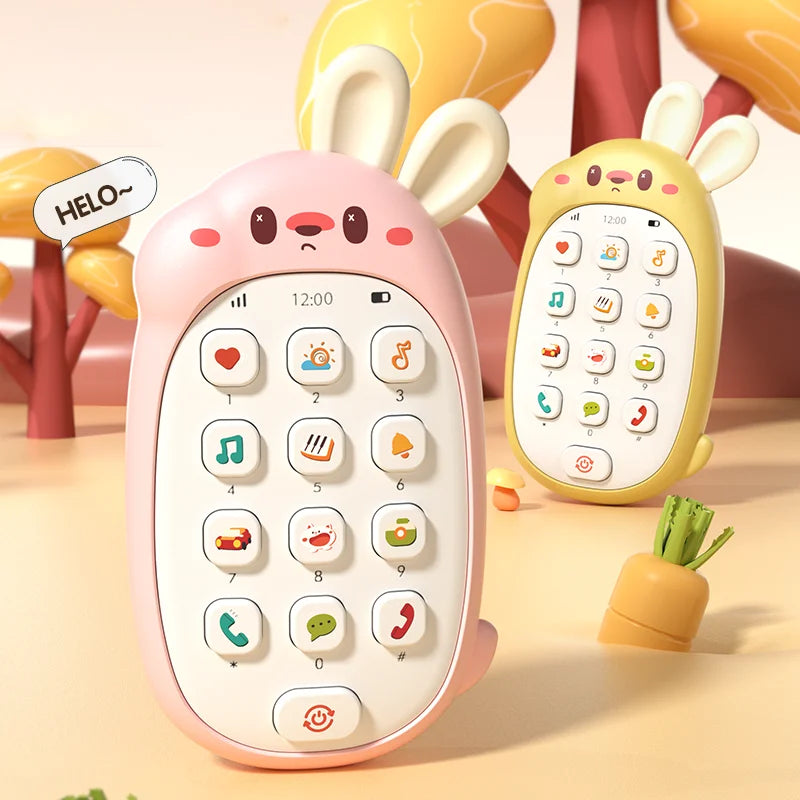 A pink rabbit-shaped baby music phone toy with a teether is shown on a light surface.
