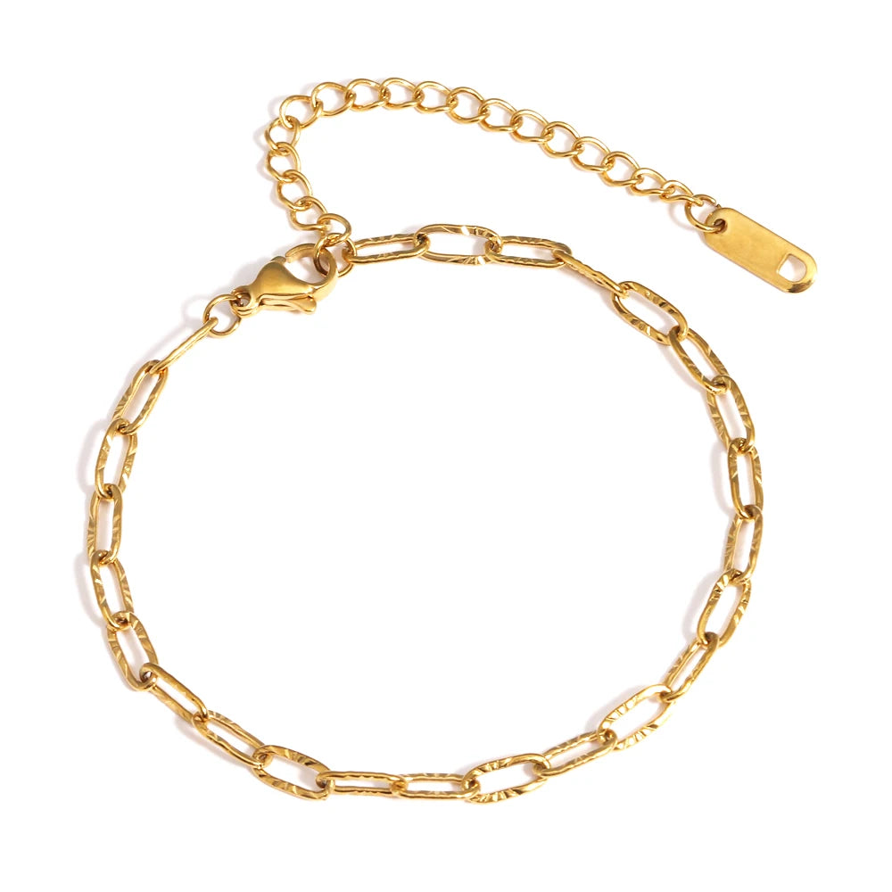 A gold-plated stainless steel link bracelet displayed against a white background.