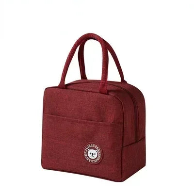 A maroon insulated lunch bag with a carrying handle, designed for thermal cooler meals on the go.