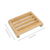 A wooden bamboo soap dish with parallel slats for fast-drying drainage.