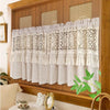 Japanese style beige sheer curtain with lace and tassel trim hanging in a wooden frame.