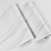 Roll of white marble peel-and-stick wallpaper showing gray veining