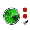 A green mini car vent quartz clock with luminous hands and a red button.