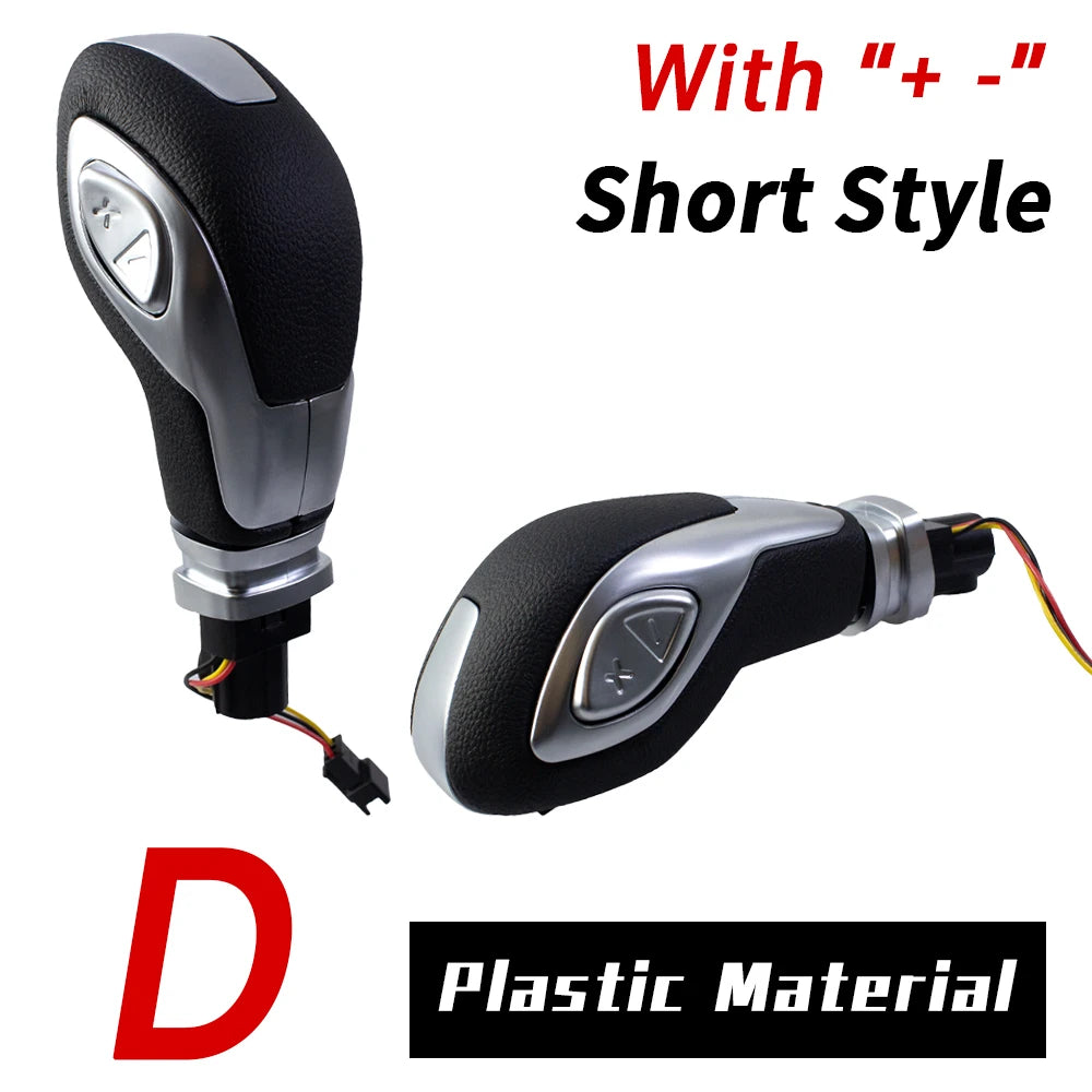 A short style gear shift knob with plus and minus markings made of plastic material