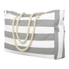 A striped canvas shoulder bag with beige rope handles, featuring horizontal white and gray stripes.