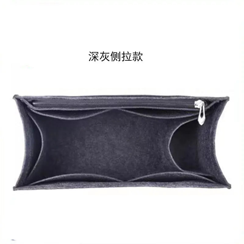 A dark gray felt bag organizer insert featuring a zippered pocket.