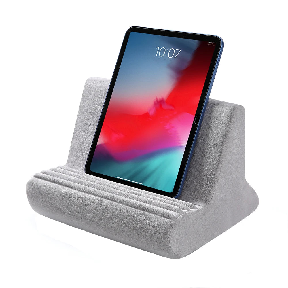 A gray fabric stand holding a tablet displaying the time 10:07.