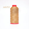 A spool of light tan heavy-duty nylon bonded thread with a red cap.