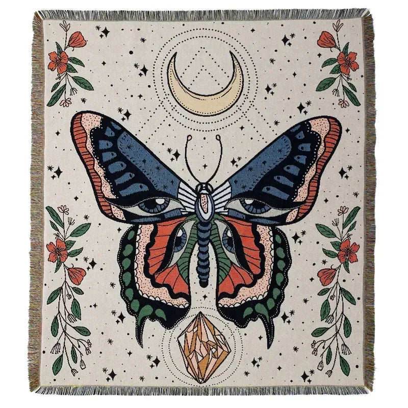 A woven throw blanket featuring a detailed butterfly design in earthy tones and floral accents.
