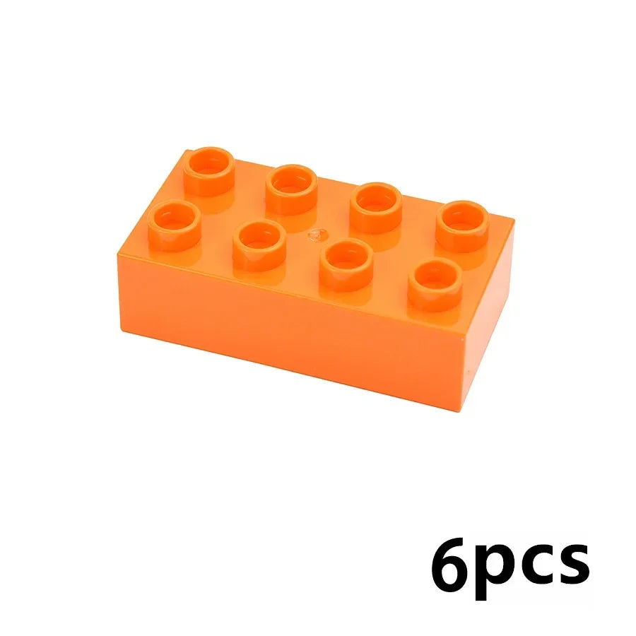 An orange plastic building block set with six round, orange pieces.