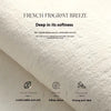 A close-up of a white, fluffy rug texture with text describing its softness and non-slip properties.