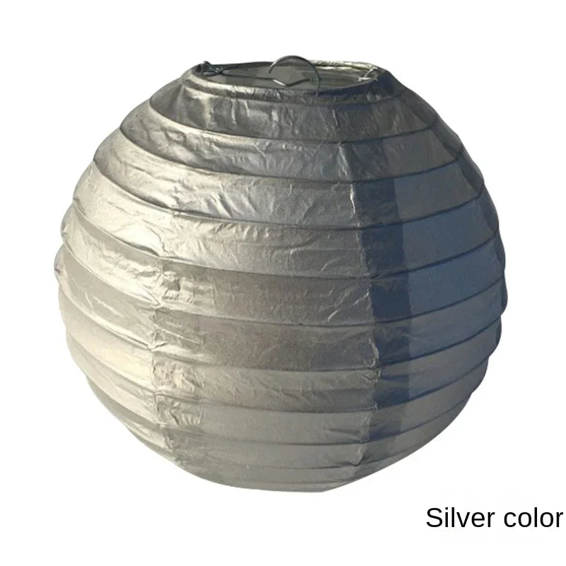 Silver foil paper lantern with a round, pleated shape.