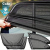 A hand is holding a black car side window sunshade with mosquito mesh, showing its texture and folding design.