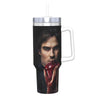 A black and white graphic of a man's face with red hand visible on an insulated stainless steel tumbler.