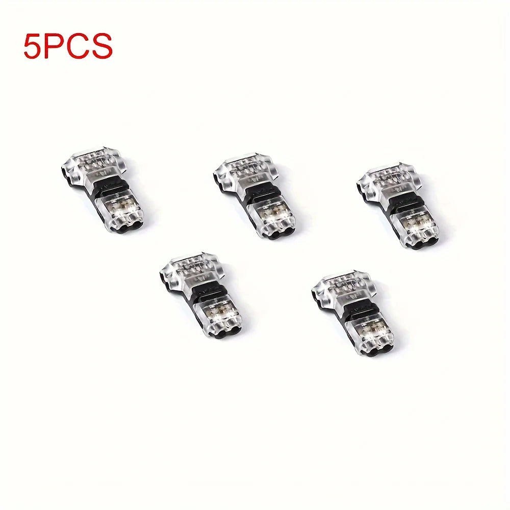Five silver electrical wire connectors or terminals for quick snap-on wiring.