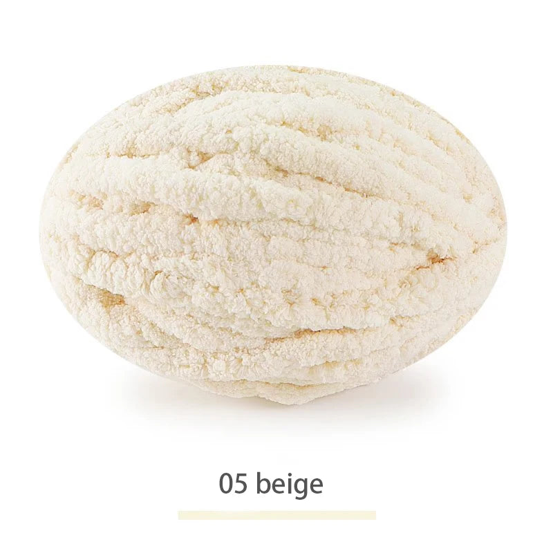 A ball of beige chenille yarn for hand knitting