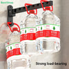 Three clear water bottles are hanging from a black wall-mounted rack, demonstrating strong load-bearing capacity.