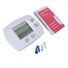 A white digital non-programmable thermostat with a large LCD display and installation instructions.