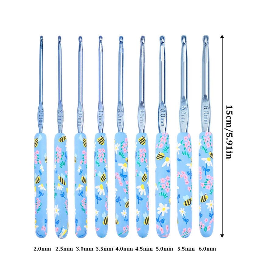 A set of ergonomic crochet hooks in various sizes from 2.0mm to 6.0mm featuring a blue and yellow bee design.