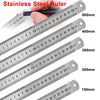 A hand is holding a stainless steel ruler showing various measurements from 150mm to 500mm.