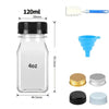 A clear glass juice bottle with a black cap and a measuring spoon, alongside various plastic containers and caps.