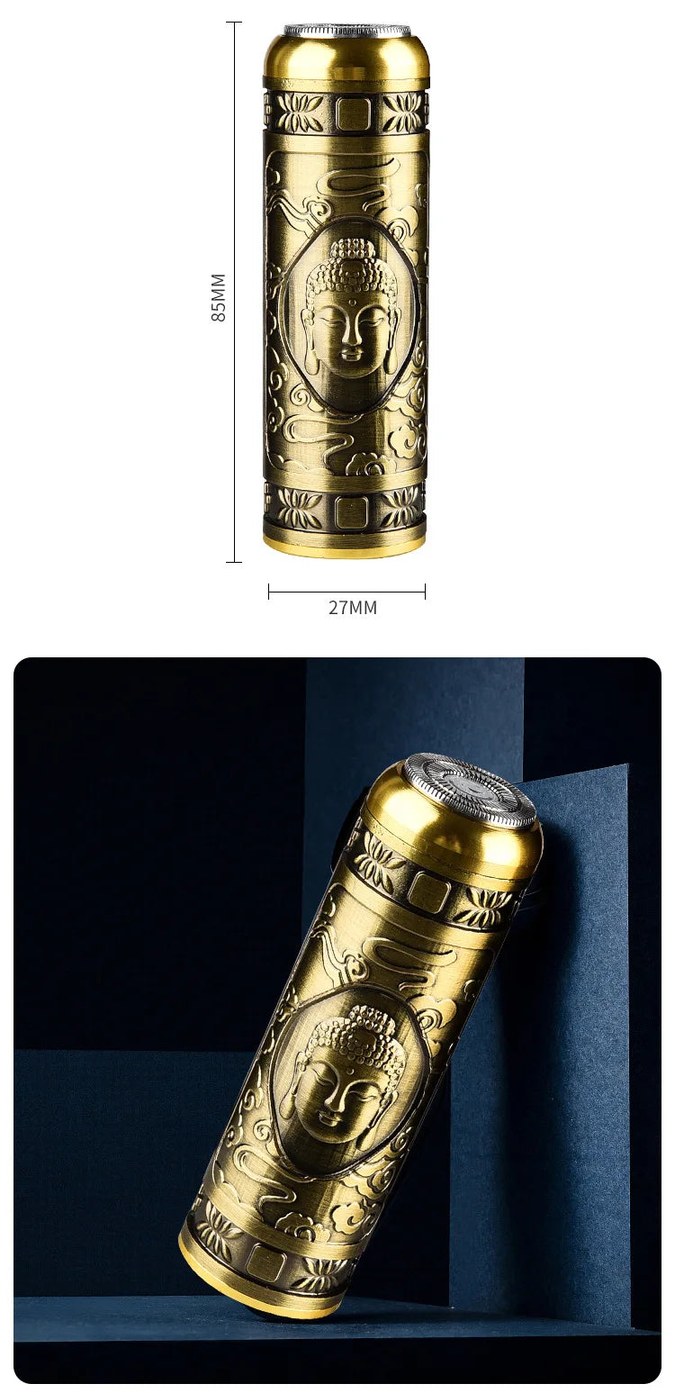 A vertical shot of a gold-colored electric razor with a Buddha face design, showing its length and detail.