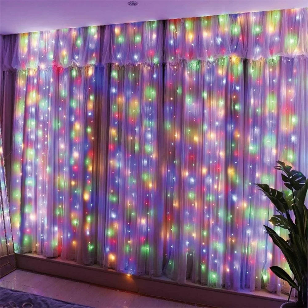Purple and pink LED curtain string lights with colorful fairy lights illuminating a window or wall.