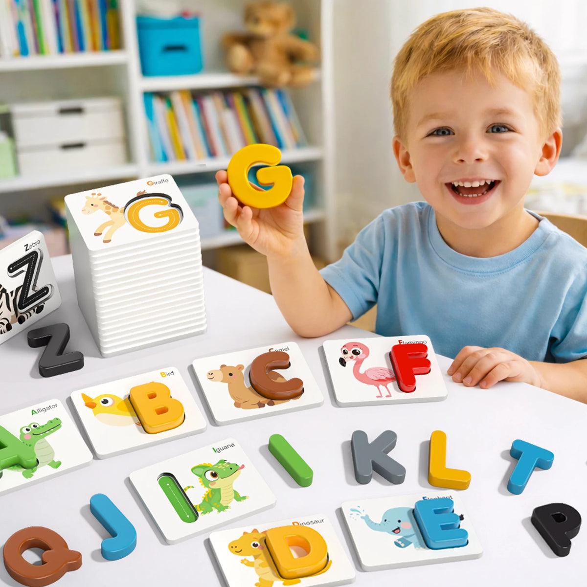 A smiling toddler holds a yellow wooden letter card while playing a spelling word game with matching cards.