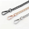 Three metal chain straps in black, gold, and silver finish displayed against a white background.