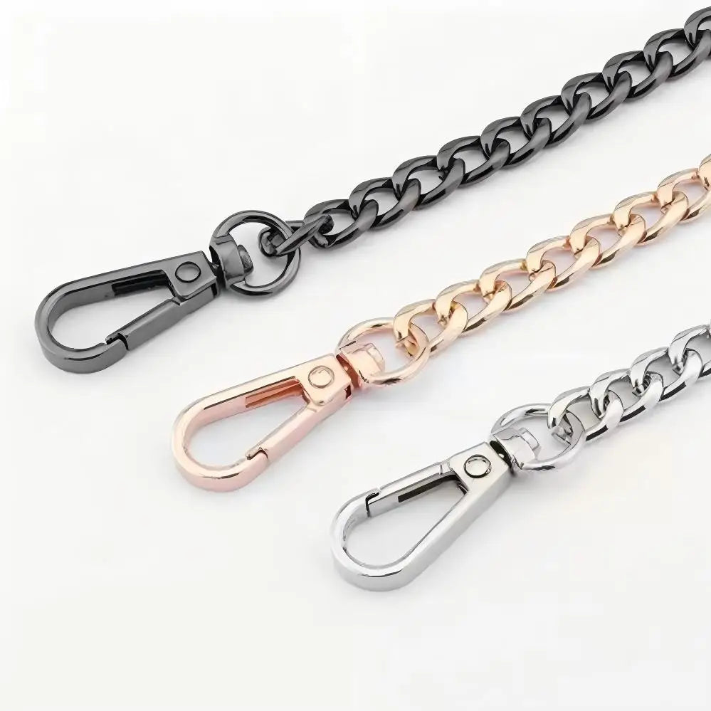 Three metal chain straps in black, gold, and silver finish displayed against a white background.