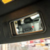 A close-up of a car decal sticker set with the text I love you drive safe displayed on a rearview mirror.